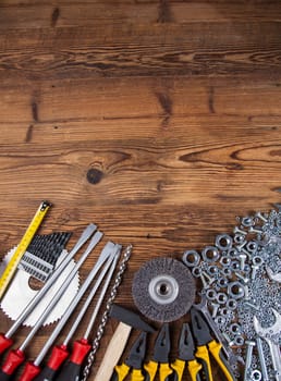Set of different tools on wooden background