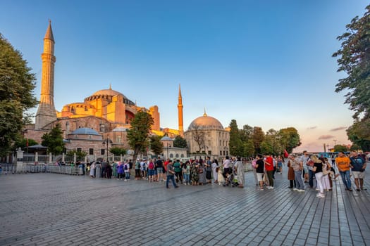 Istanbul, Turkey - August 5, 2022: People People in a long line to Hagia Sophia Camii mosque or Ayasofya (Turkish), Istanbul, Turkey.
