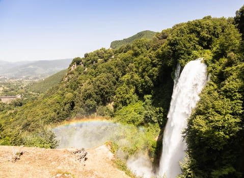 Marmore waterfall in Umbria region, Italy. Amazing cascade splashing into nature with trees and rocks.