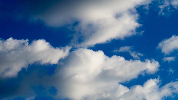 Clouds illuminated by the sun in the sky as background. Background image for further editing