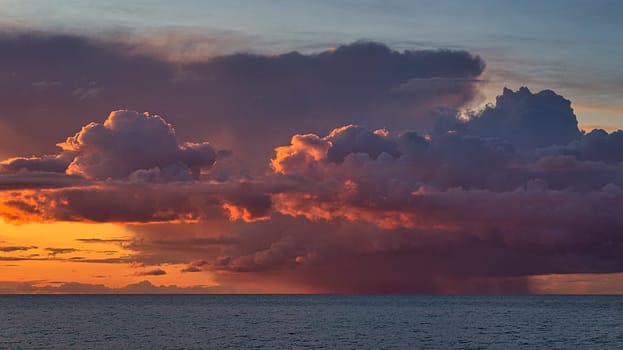 dramatic sunset with rain clouds. color spectacle on the Baltic Sea in Zingst. powerful and yet also romantic natural spectacle