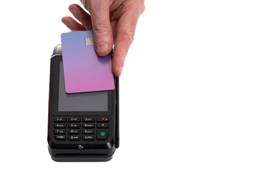 Attached plastic card to the payment terminal with a man's hand on a white isolated background, copy space. High quality photo