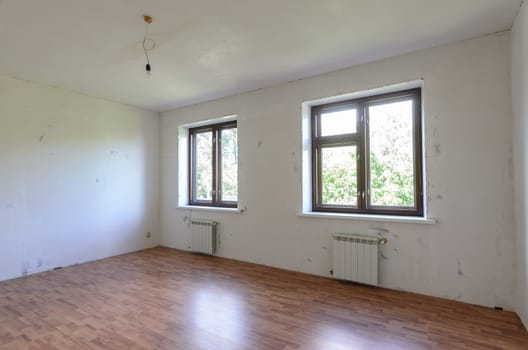 A fragment of a room with a fine finish, a view of two windows