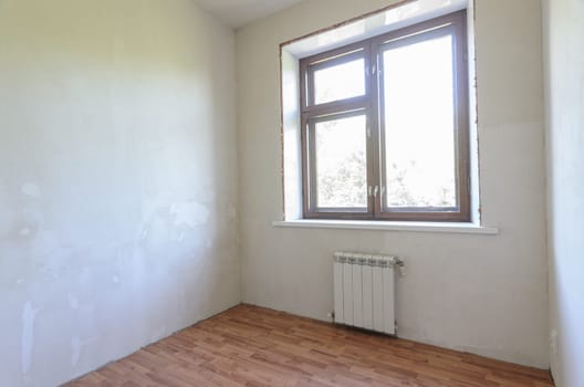 View of the window in a small room with a fine finish after repair