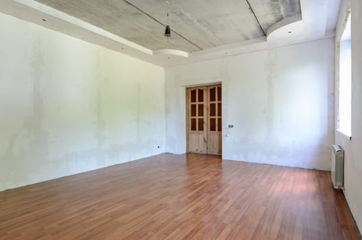 Interior of an empty room prepared for wallpapering