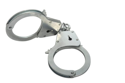 Metal handcuffs on a white isolated background, copy space. High quality photo