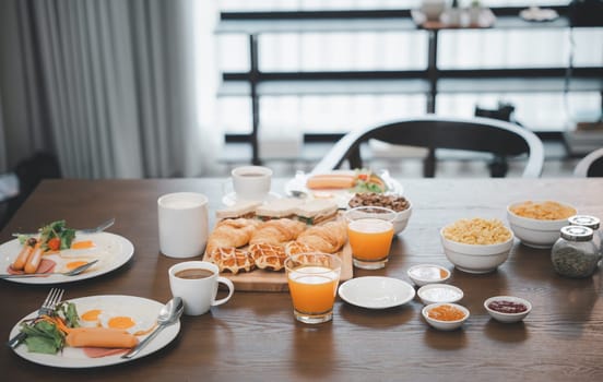 Fresh and bright continental breakfast healthy, Breakfast served food with beverage coffee, orange juice on table in the morning at home