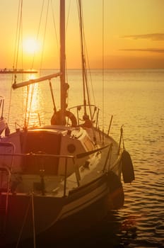 Luxury yacht in marina. Holiday traveling by sail boat at beautiful sunset in summer.