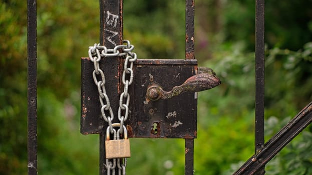 double holds better. Padlock that secures a locked door. Weathered property is secured.