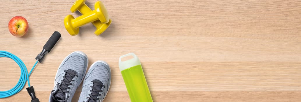 Sport and fitness equipment on a wooden background