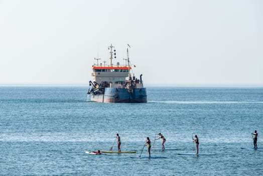 Stand-up paddlers on the North Sea coast