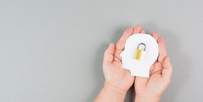 Silhouette of a head with a lock, lockout from computer cloud, safety concept, mental health, protection of thoughts and privacy