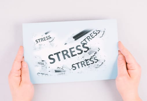 The word stress is standing on a paper, pen with eraser, burnout concept, work life balance, breakdown by exhaustion