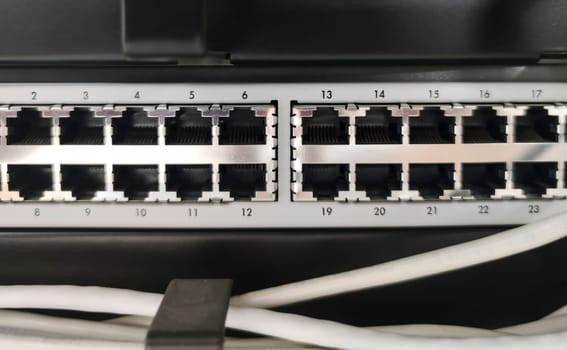 Ethernet Switch device full of wires. Closeup