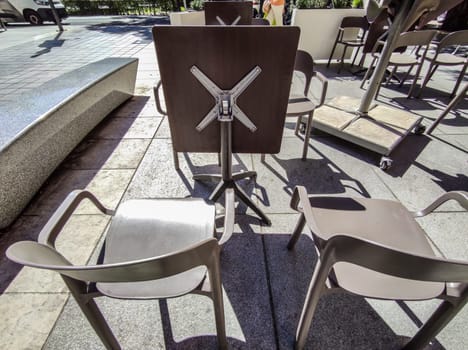Foldable tabletop terrace tables. Terrace restaurant furniture concept