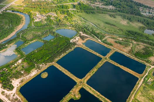 Aerial View Retention Basins, Wet Pond, Wet Detention Basin Or Stormwater Management Pond, Is An Artificial Pond With Vegetation Around The Perimeter, And Includes A Permanent Pool Of Water In Its Design.