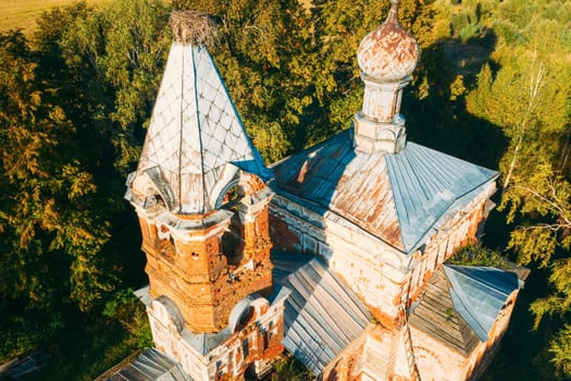 Martinovo, Beshenkovichsky District, Vitebsk Region, Belarus. Bird's-eye View Of Church Of The Intercession Of The Most Holy Theotokos. Aerial View Of Historic Landmark In Autumn Sunny Evening. Close Up.