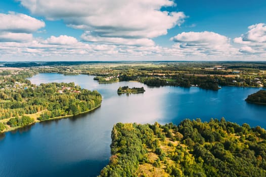 Lyepyel District, Vitebsk Region, Belarus. Aerial View Of Lyepyel Cityscape Skyline In Summer Day. Sunny Sky Above Lepel Lake. Top View Of European Nature From High Attitude In Summer. Bird's Eye View.