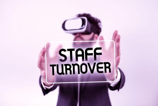 Sign displaying Staff TurnoverThe percentage of workers that replaced by new employees, Internet Concept The percentage of workers that replaced by new employees Man With A Pen Pointing On Power Button Symbol Containing Data.