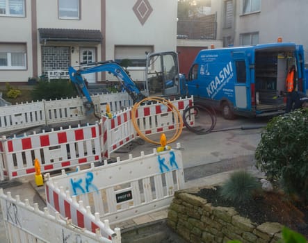 HEILIGENHAUS, NRW - OCTOBER 29, 2019:.Civil engineering works for the installation of gas, water and power lines for a new environmentally friendly fuel cell heating
