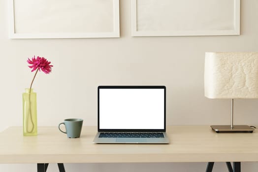 laptop computer on desk showing white screen