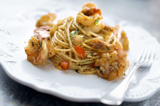 close up of italian spicy garlic shrimp pasta