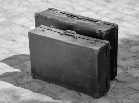 A close-up, detail shot of an old leather suitcase.
