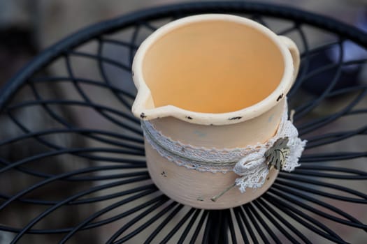 An enameled crucible, pot on a table.