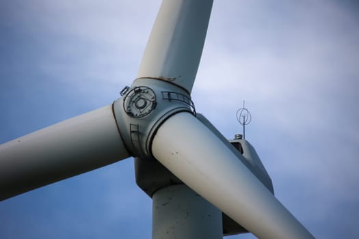 Close-up of the hub of a wind turbine. Blade and hub of a wind turbine.
