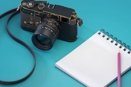 3D Illustration. 3D Rendering , Cameras  with white paper and pencil on blue background. Concept Business , Travel , school