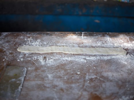 Preparation of flour for making Pa Tong Go or Chinese Traditional Snacks Deep Fried Dough Stick. Concept popular THAI breakfast