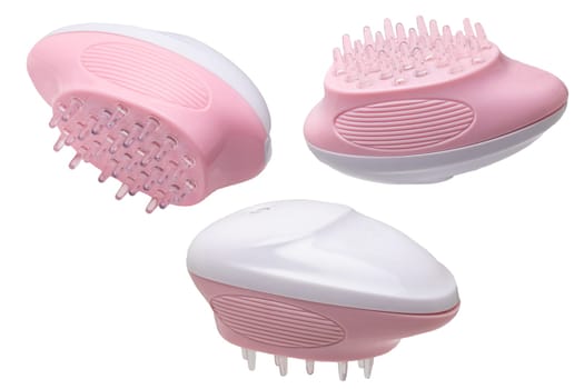 Close up of three battery operated scalp massage brushes, shampoo brushes or scalp massager for exfoliating and massaging the scalp. Beauty and health concept.