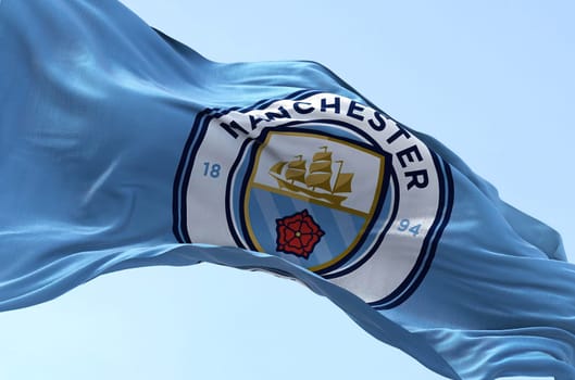 Manchester, UK, May 2022: The flag of Manchester City Football Club waving in the wind. Manchester City is an English football club based in Manchester that competes in the Premier League
