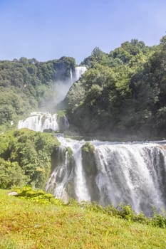 Marmore waterfall in Umbria region, Italy. Amazing cascade splashing into nature with trees and rocks.
