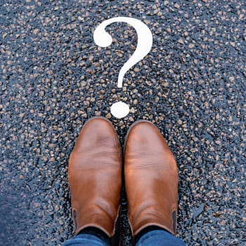 Woman is thinking, question marks on the road, brainstorming and looking for answers, solving a problem, making a decision, business and education concept