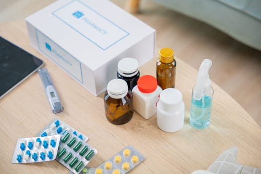 Home medicine with medicine package box free first aid kit with pills from pharmacy hospital delivery service at home on table in living room,  online purchase delivery of medicines to your home
