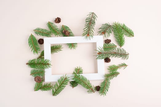 Christmas holiday background, frame with fir branches and cones, winter season greeting card with copy space