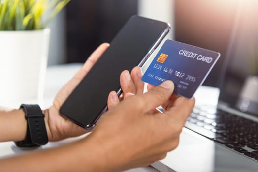 Woman hands holding credit card and smartphone with product purchase at home, Female register via credit cards on mobile phone to make digital payment security online, Internet online shopping concept