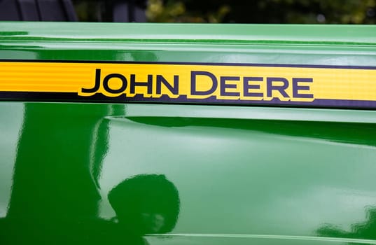 GERMANY - WETZLAR JULY 08: John Deere Logo on a Tractor. JOHN DEERE is a leading provider of agricultural equipment in the United States
