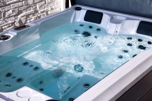 Details of a whirlpool with many jets for massage.