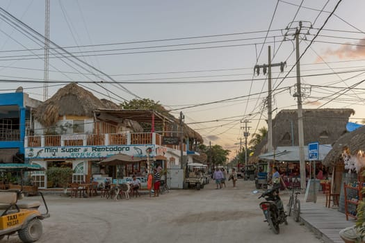 Tourists on a sandy road in Holbox Island, Quintana Roo, Mexico
