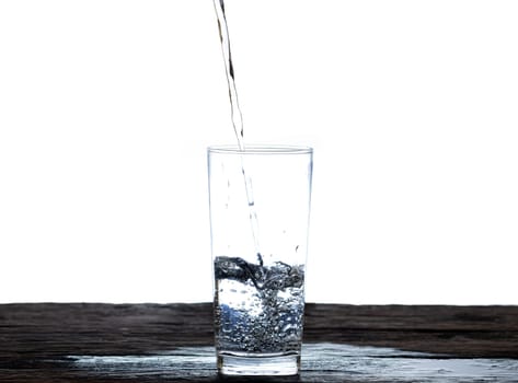 The image of pouring drinking water, into a glass, that makes one feel refreshed isolated on white background, Splashing water, Sparkling water