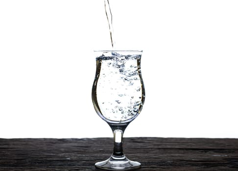 The image of pouring drinking water, into a glass, that makes one feel refreshed isolated on white background, Splashing water, Sparkling water