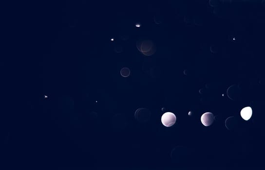 Light abstract dark bokeh christmas circle color glitter blurred black background