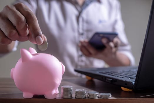 Save money and account banking for finance concept, Piggy bank with coin on blurred background, Save Monney for Investors Using Internet to Trade Stocks or Trade Fund