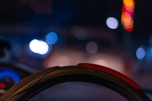 Driving car concept, Driving a car on the road in night city time blurred light bokeh background