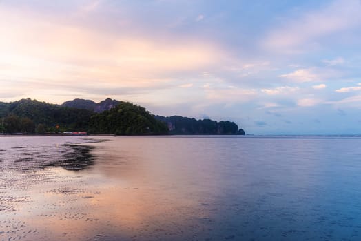 Beach sunset or sunrise with colorful of cloud sky and sunlight in twilight