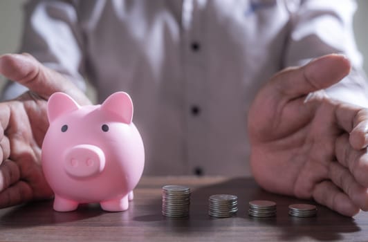 Save money and account banking for finance concept, Piggy bank with coin on blurred background, Save Monney for Investors Using Internet to Trade Stocks or Trade Fund