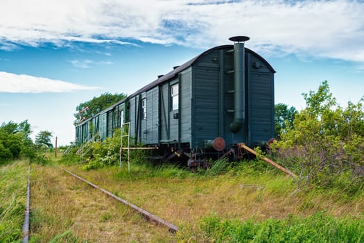 old wagons and tracks on the former railway line to Fischland-Darss peninsula, Bresewitz, Mecklenburg-Western Pomerania, Germany