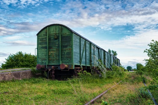 old wagons and tracks on the former railway line to Fischland-Darss peninsula, Bresewitz, Mecklenburg-Western Pomerania, Germany
